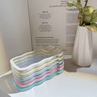 Transparent silicone iPhone case with multicolor pastel wavy border trim and camera cutouts