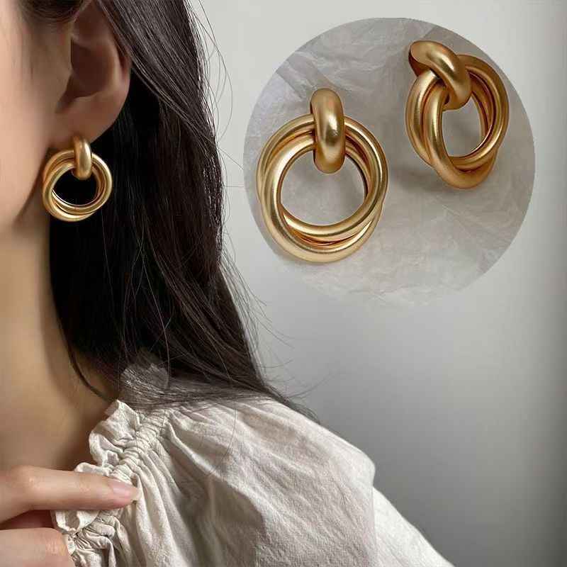 Gold hoop earrings with double stacked ring ornaments