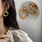 Gold hoop earrings with double stacked ring ornaments