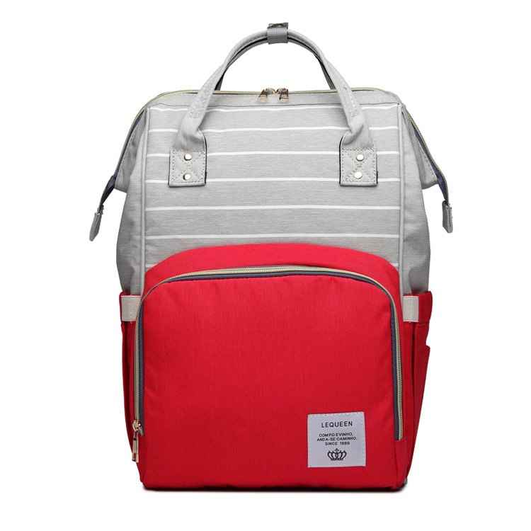Gray maternity diaper bag with white stripes and red front pocket, top handle and side straps