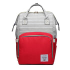 Gray maternity diaper bag with white stripes and red front pocket, top handle and side straps