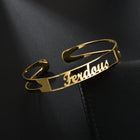 Gold stainless steel open cuff bracelet with engraved cursive name plate