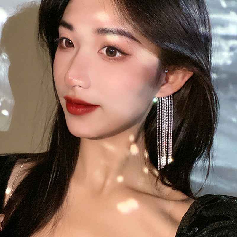 Long rhinestone tassel earrings with silver fringe and small sparkle stud tops