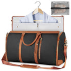 Foldable dark duffle bag with tan trim, zip top, and front pocket with tassel zippers