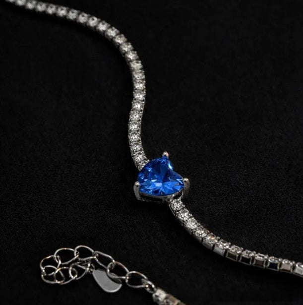 Silver-tone zircon bracelet with blue heart-shaped stone and chain links