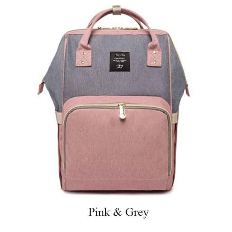 Maternity diaper bag in mauve pink and gray with front zipper pocket and top carry handle