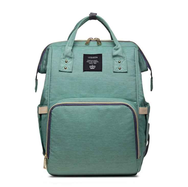 Mint green maternity diaper bag with front zip pocket and top carry handles
