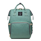 Mint green maternity diaper bag with front zip pocket and top carry handles