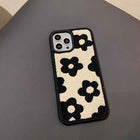 Plush floral iPhone case, cream and black flower pattern; raised camera cutouts on back