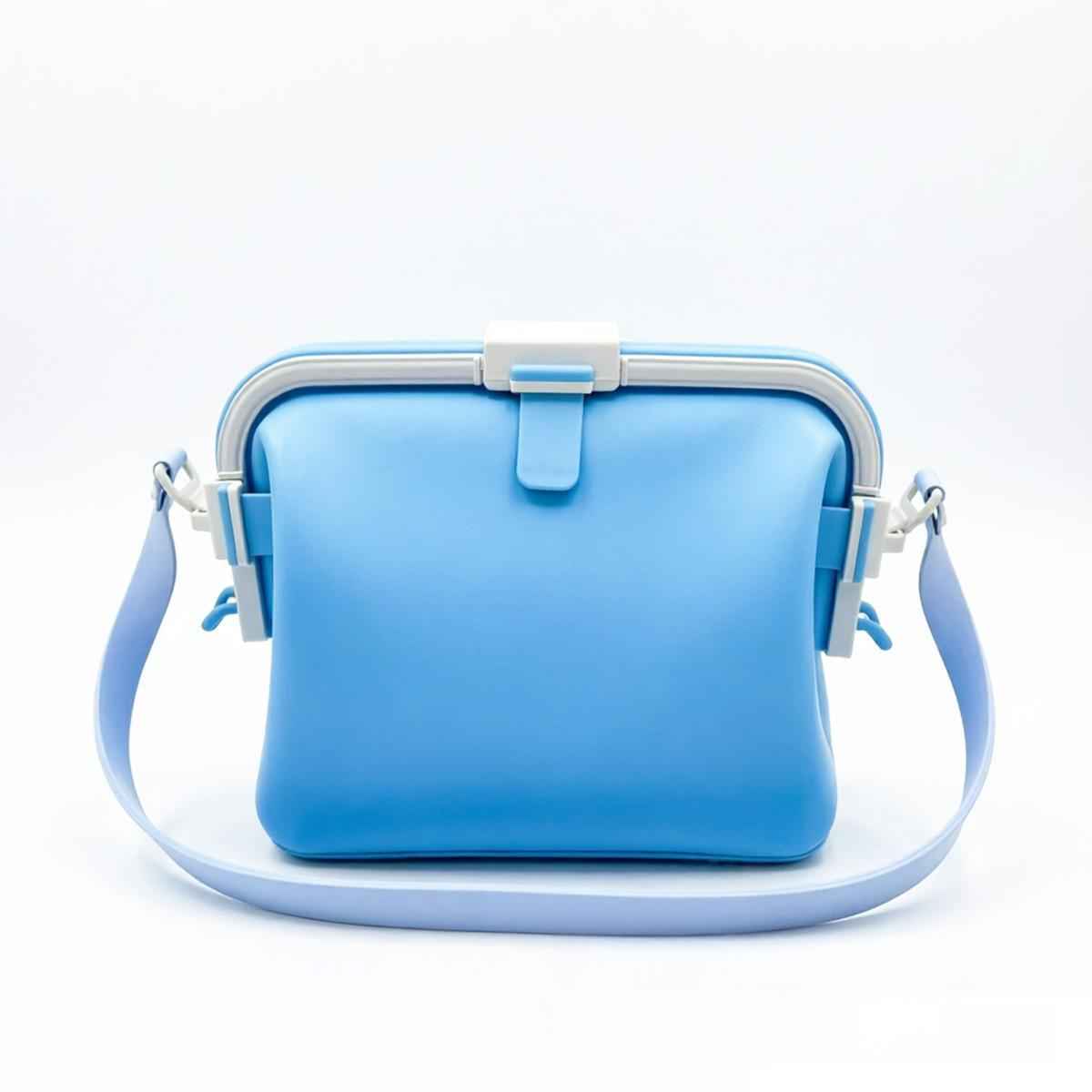 Waterproof silicone pouch in light blue with flip-top clasp and side carry straps