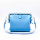 Waterproof silicone pouch in light blue with flip-top clasp and side carry straps