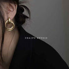 Gold baroque hoop earrings with double stacked ring loops