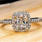 Bridal ring set with a cushion-cut center stone and pavé band
