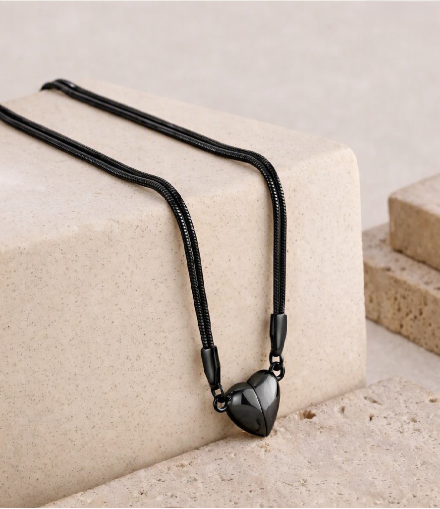Magnetic heart necklace with black cord and heart-shaped pendant