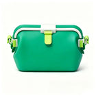 Waterproof silicone pouch in green with flip-top clasp, side straps, and short handles