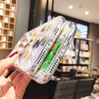 Clear iPhone case with preserved floral pieces, camera cutout visible
