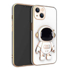 White phone case with 3D astronaut charm, ring grip, and dual camera cutouts