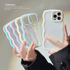 Two transparent silicone iPhone cases with pastel wavy border trim and raised camera cutouts