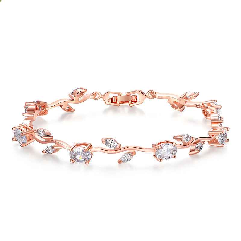 Rose gold crystal cuff bracelet with mixed red, green, and clear stones