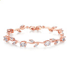 Rose gold crystal cuff bracelet with mixed red, green, and clear stones