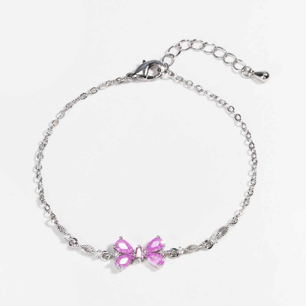 Silver chain bracelet with two pink heart-shaped rhinestone charms, adjustable clasp