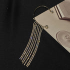 Long silver rhinestone tassel earrings with stacked dangling strands and hoops