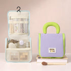 Open cream hanging toiletry organizer with clear mesh pockets and mint trim