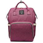 Burgundy pink maternity diaper bag with front zip pocket and top carry handles