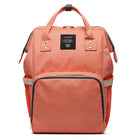 Maternity diaper bag in peach coral with front zipper pocket and black-trim interior section