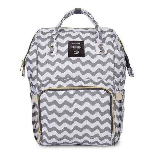 Gray wavy print maternity diaper bag with front zip pocket and black side panels, top handle