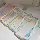 Transparent silicone iPhone case with multicolor pastel wavy border trim and camera cutouts