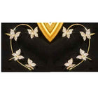 Gold butterfly earrings with hoop frame and sparkling butterfly accents on a black surface