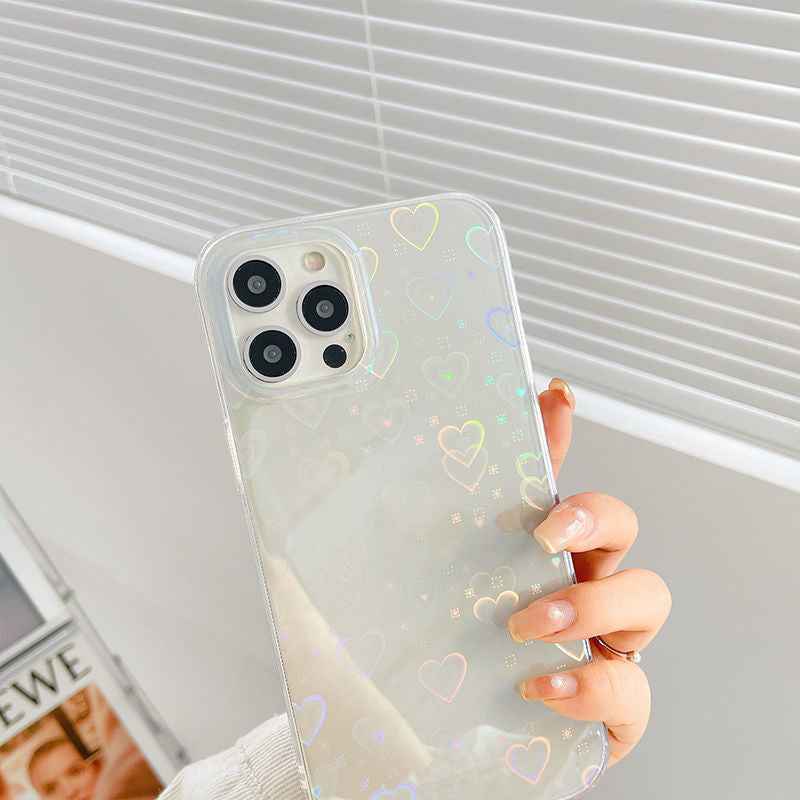 Cream transparent iPhone case with colorful heart pattern, close-up of hand holding