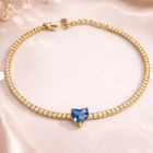 Gold-tone zircon bracelet with a blue heart-shaped center stone