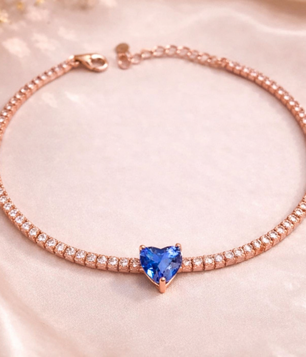 Rose gold-tone zircon tennis bracelet with blue heart-shaped center stone