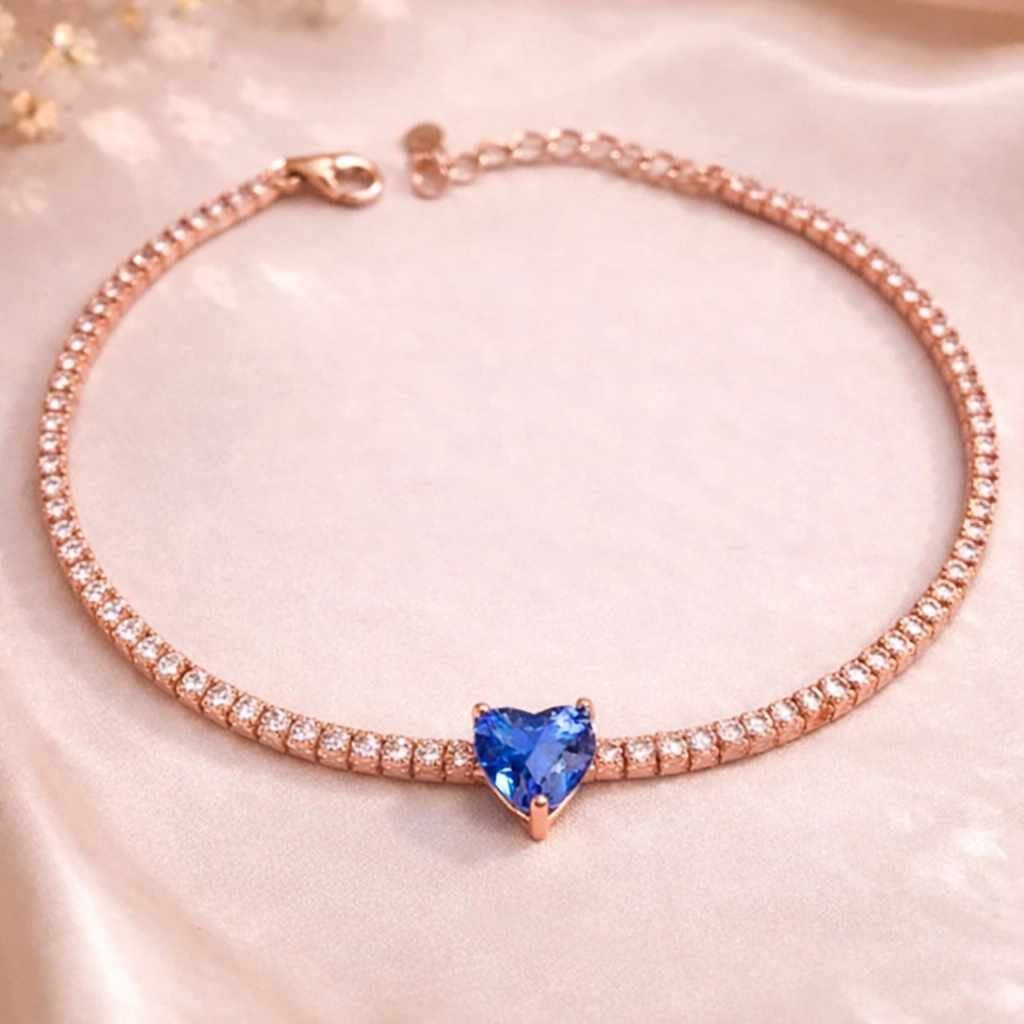 Rose gold-tone zircon tennis bracelet with blue heart-shaped center stone