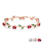 Rose gold crystal cuff bracelet with red, green, and clear stones