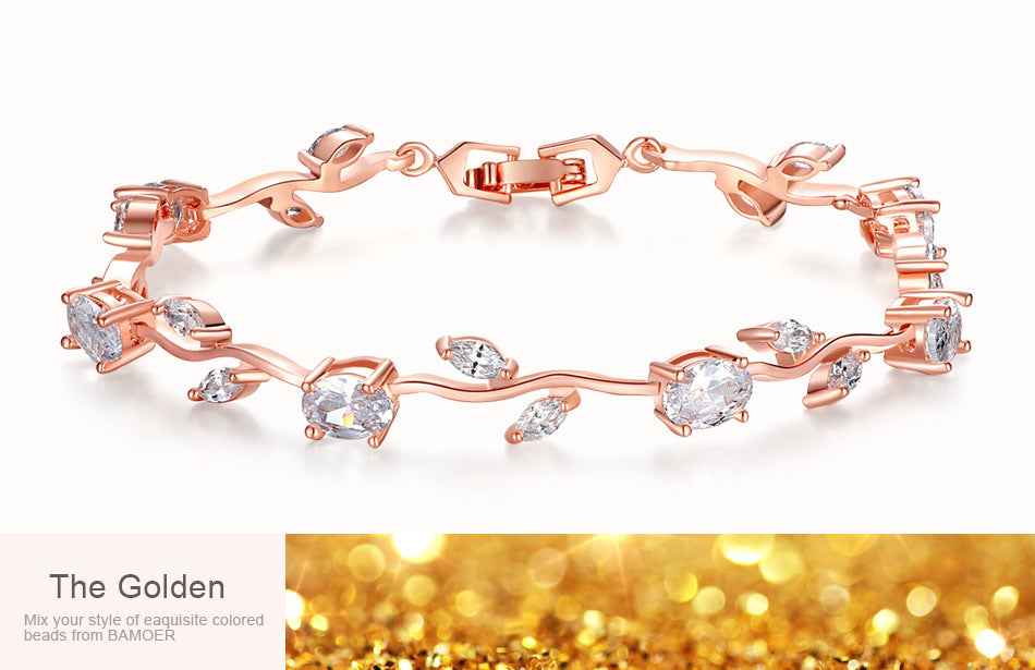 Crystal cuff bracelet in rose gold tone with red, green, and clear stones