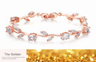 Crystal cuff bracelet in rose gold tone with red, green, and clear stones