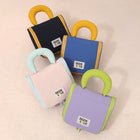 Set of hanging travel makeup bags in blue, black, pink, and purple