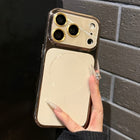 White phone case with gold-toned edges and raised camera lens guard
