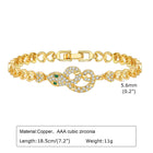 Gold-tone crystal bracelet with heart-shaped charm details and hinged clasp