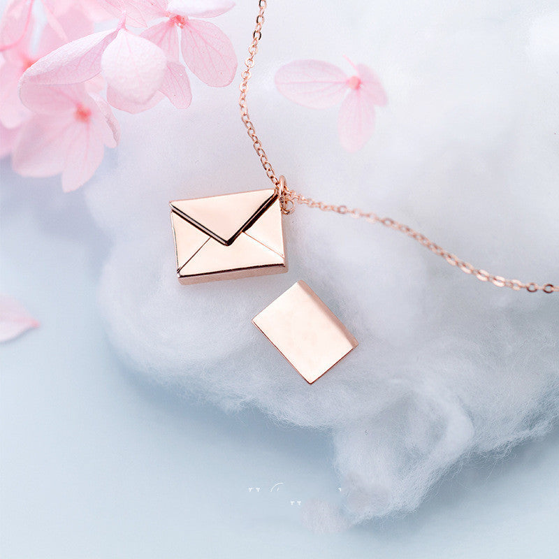 Rose gold envelope pendant necklace with open-letter style charm