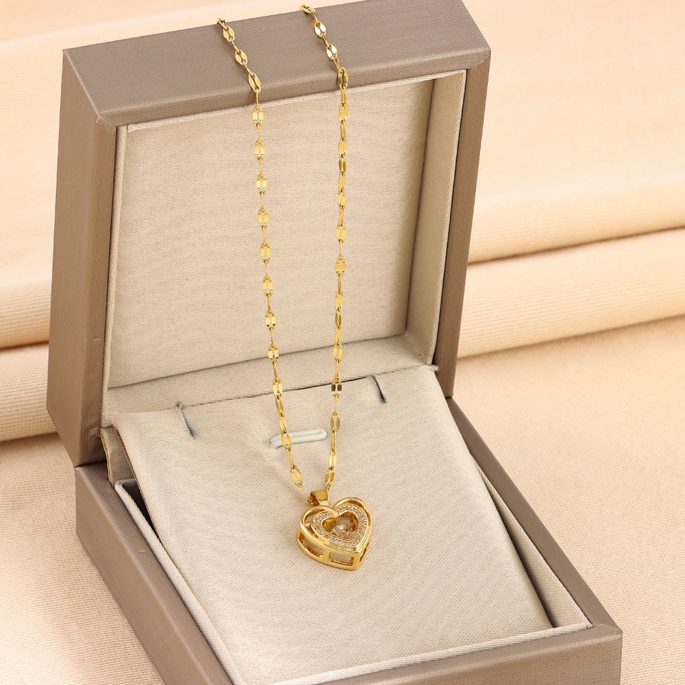 Gold-tone heart pendant necklace with two chain strands in a display box