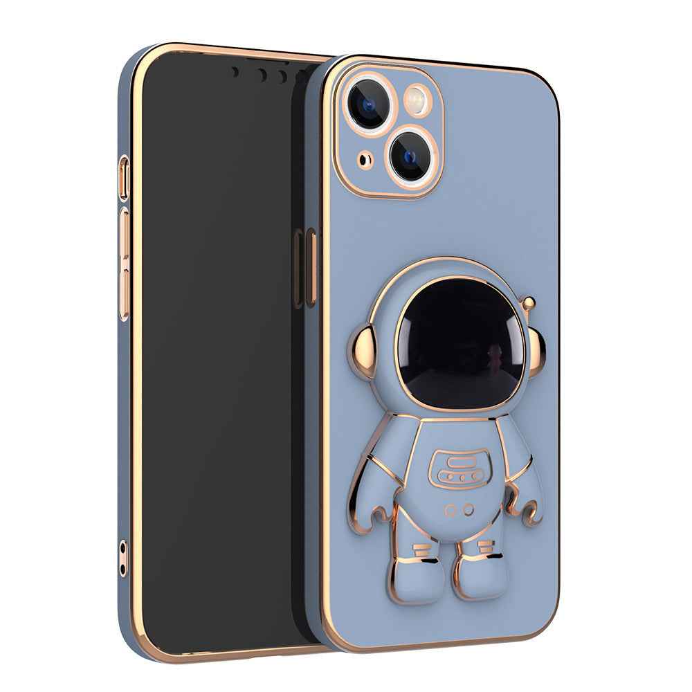 Light blue phone case with 3D astronaut charm, ring grip, and dual camera cutouts