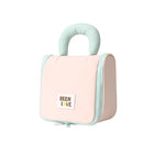 Light pink hanging makeup bag with mint handle and zip side panel