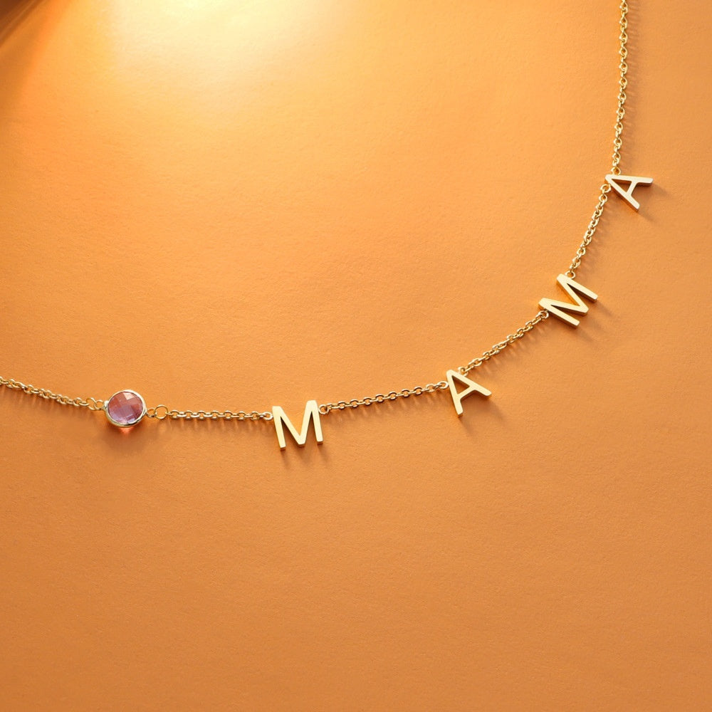 Gold initial necklace with pink round stone bead and letter charms M A