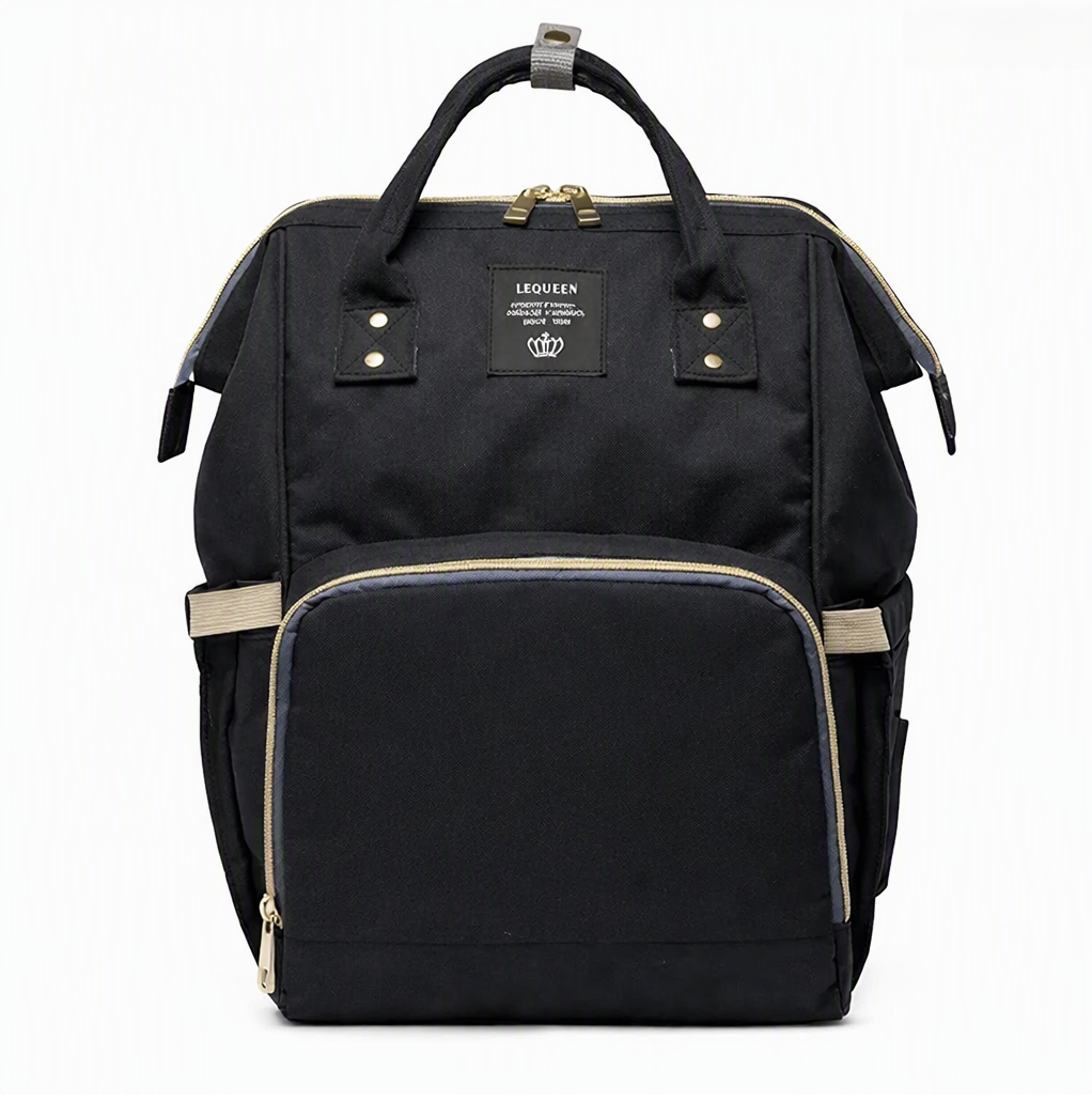 Black diaper backpack with beige trim, front zip pocket, and buttoned side straps
