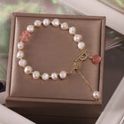 Freshwater pearl bracelet in gift box with white pearls and green and pink charm dangles