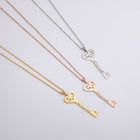 Gold, rose gold, and silver key pendant necklaces with heart-shaped key charms